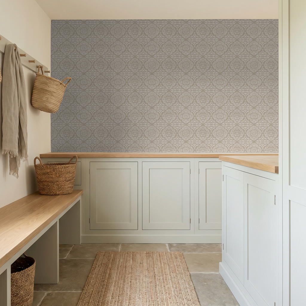 Antique ornamental damask wallpaper in taupe and cream in a cozy entryway.