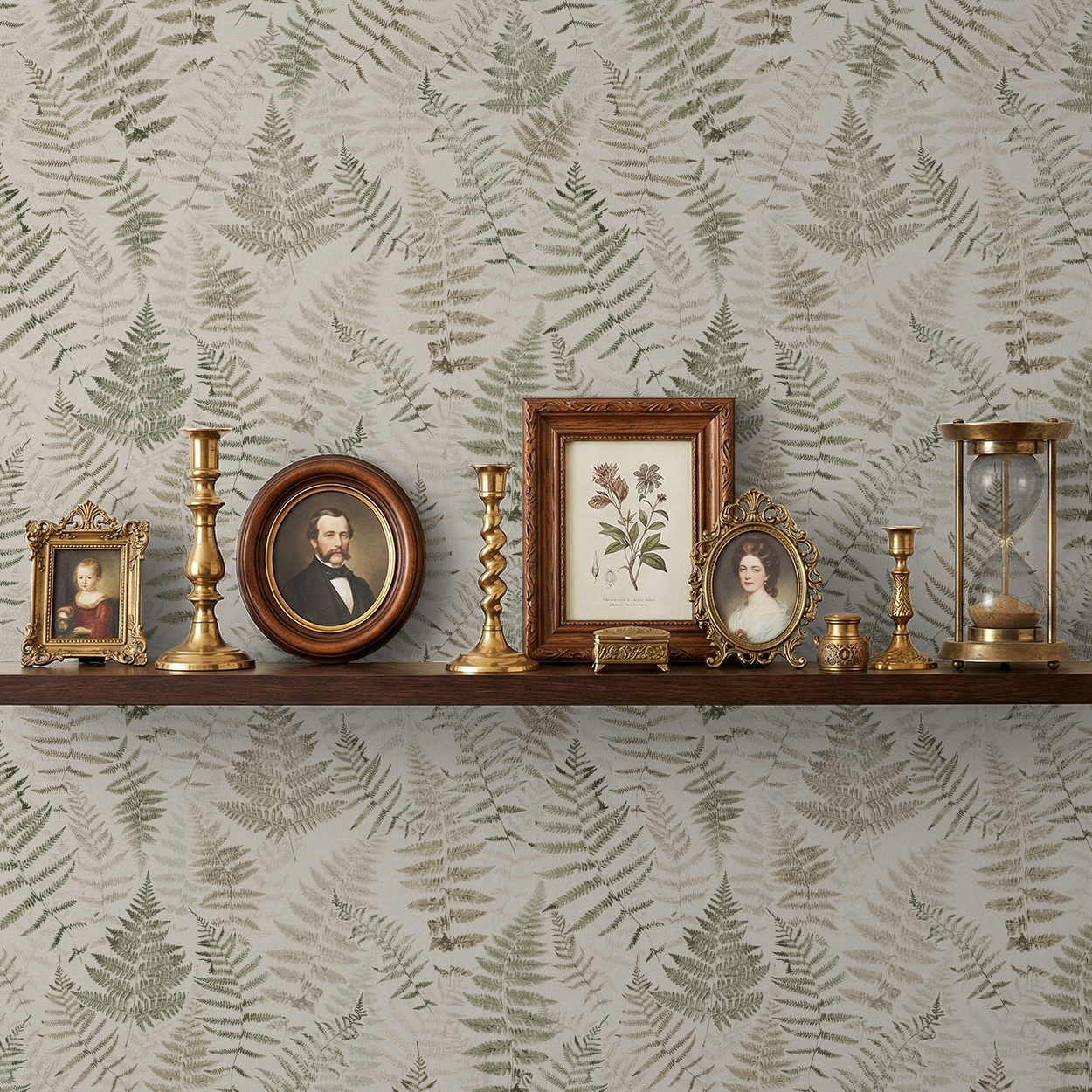 Botanical fern wallpaper with cream and walnut tones behind vintage decor on shelf.