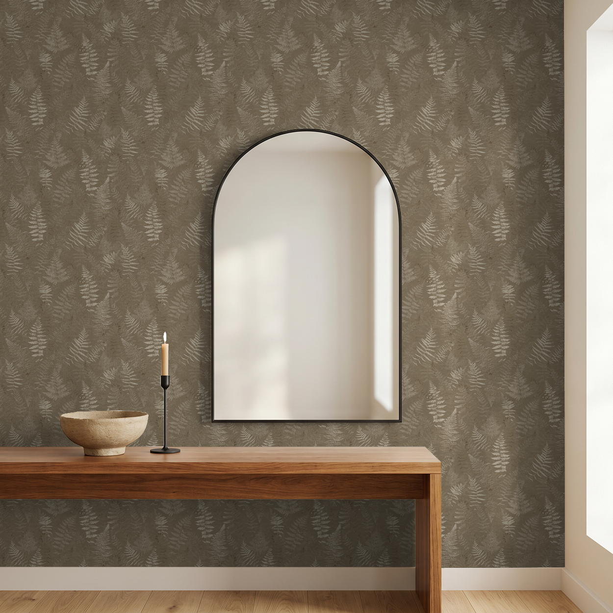 Botanical fern wallpaper in taupe and cream with wooden table and mirror.