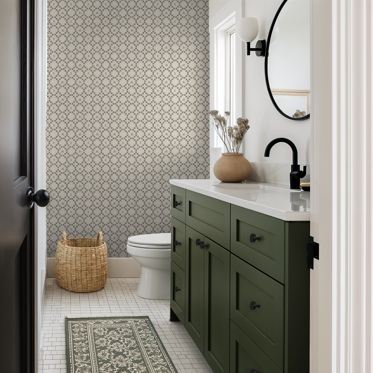 Botanical lattice olive on cream wallpaper in modern bathroom with green vanity.