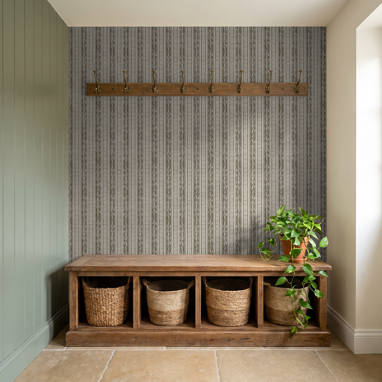 Botanical stripe olive wallpaper with laurel motifs in rustic entryway setting.