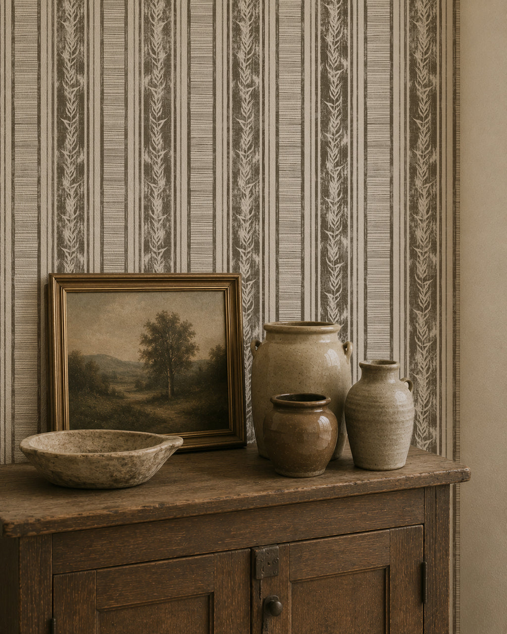 Botanical stripe olive wallpaper with laurel motifs in rustic room setting.