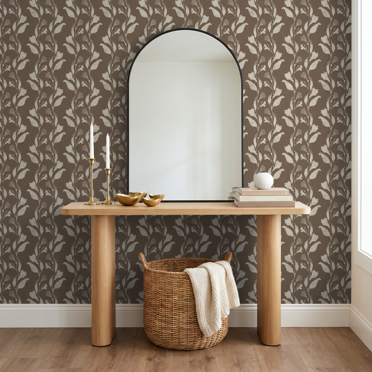 Botanical vine cream on taupe wallpaper in rustic entryway with mirror and basket.