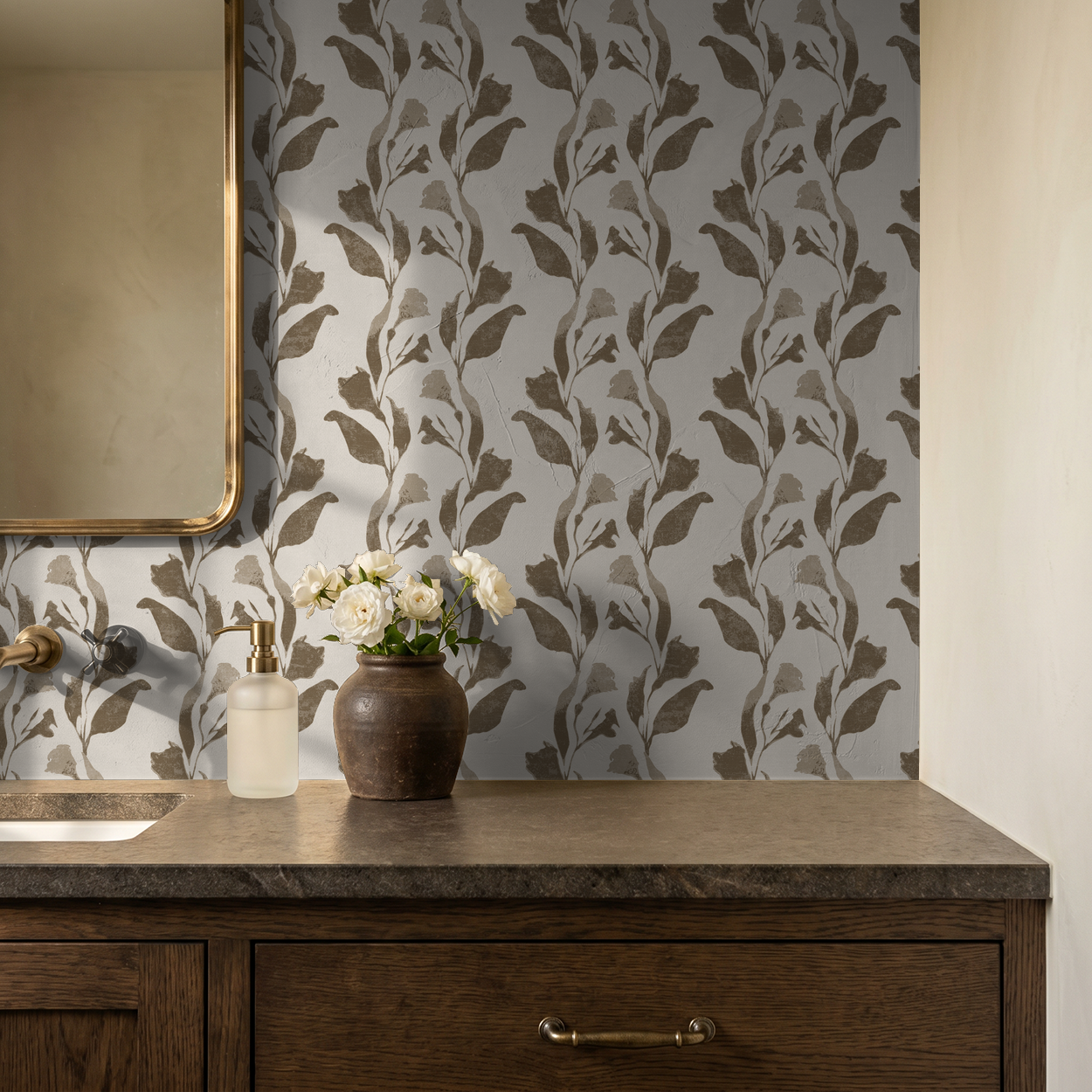 Botanical vine taupe on cream wallpaper in elegant bathroom setting.