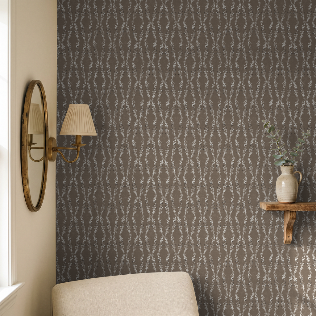 Brown botanical vine wallpaper in cozy room with mirror and shelf decor.