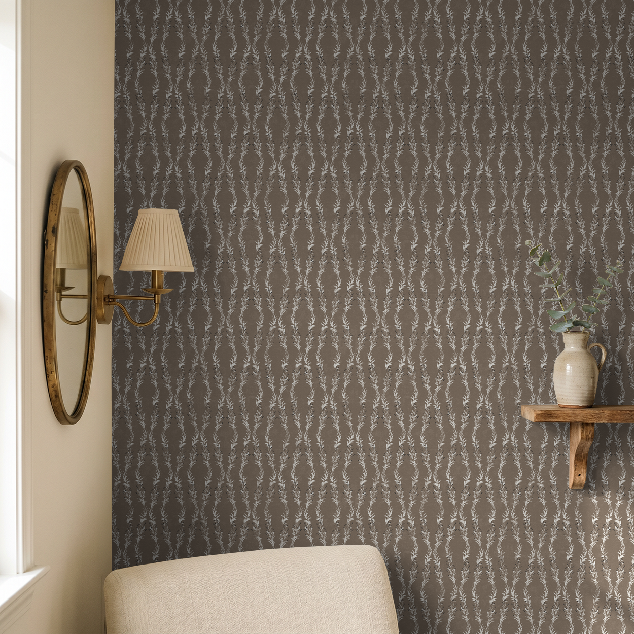 Brown botanical vine wallpaper in cozy room with mirror and shelf decor.