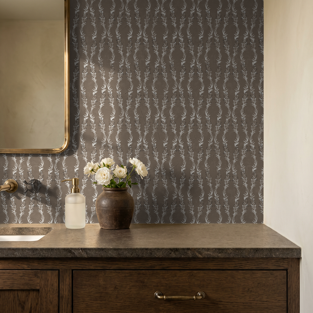 Brown botanical vine wallpaper in rustic bathroom setting with wooden vanity.