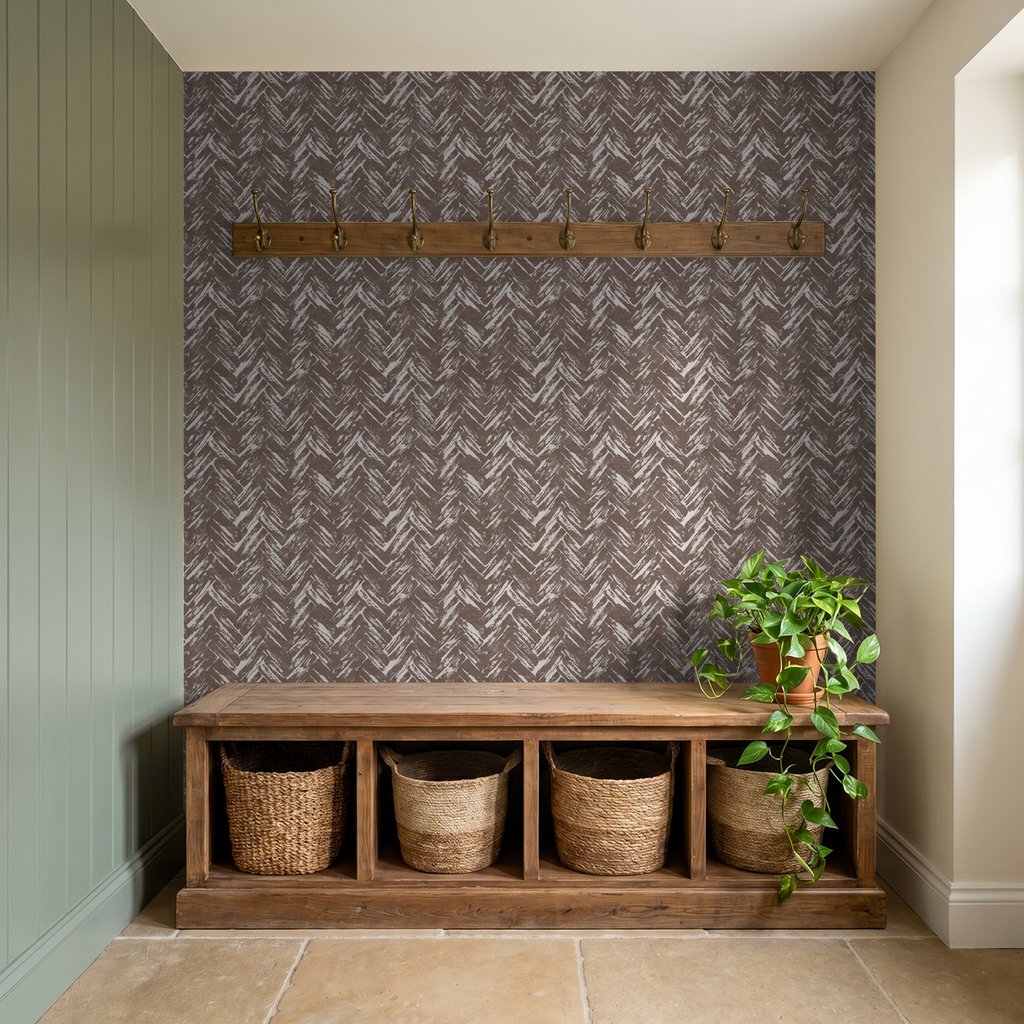 Brown chevron herringbone wallpaper in rustic entryway with wooden bench and plant.