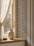 Brown floral stripe wallpaper in cozy room with vase and curtain