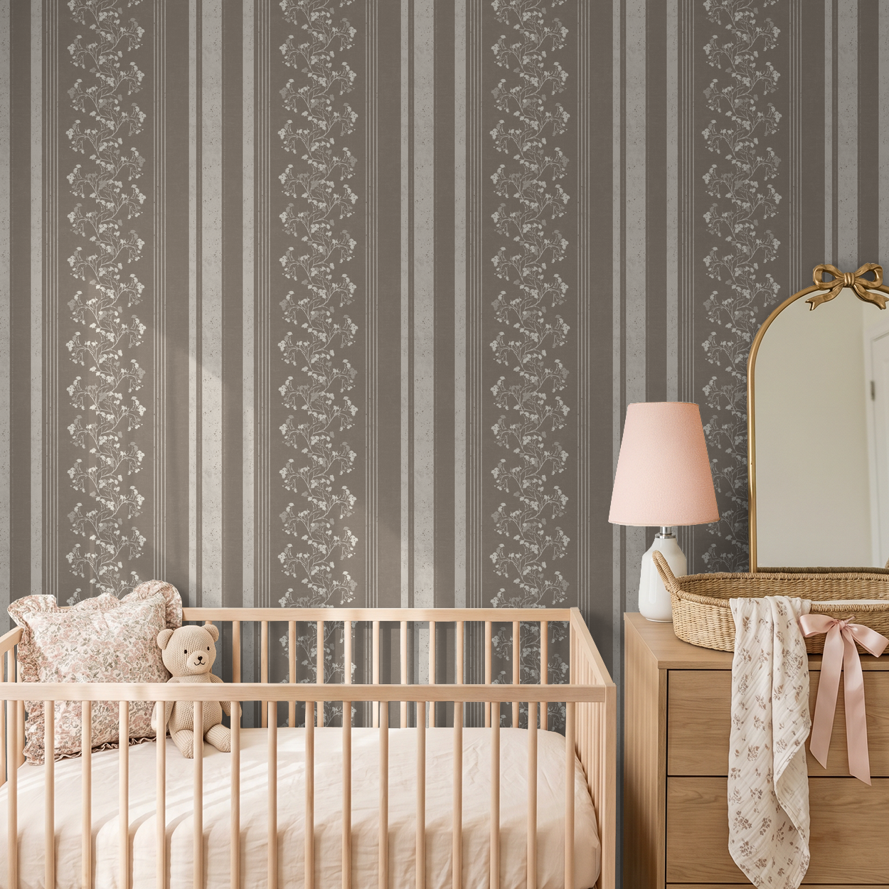 Brown floral stripe wallpaper in nursery with crib and dresser.
