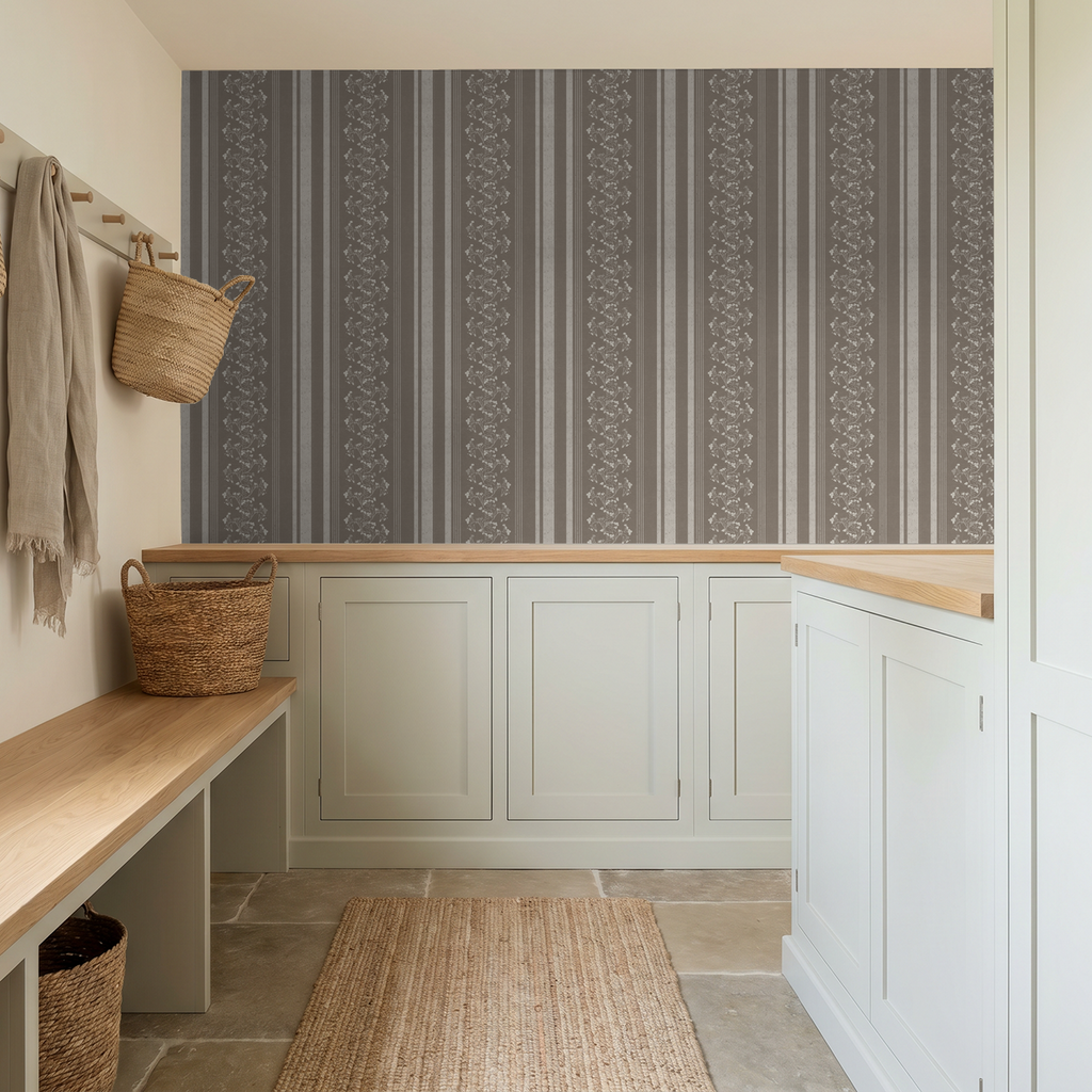 Brown floral stripe wallpaper in a rustic entryway with woven baskets.
