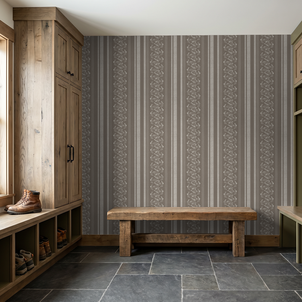 Brown floral stripe wallpaper in rustic entryway with wooden furniture.
