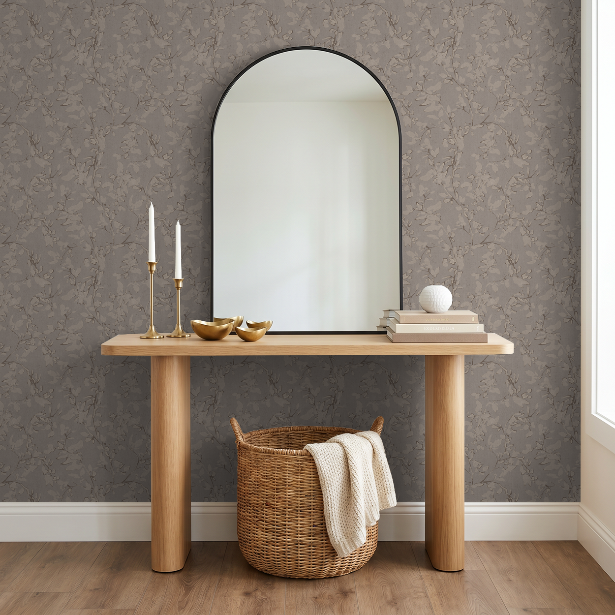 Brown floral vine wallpaper in elegant room with mirror and wooden console.