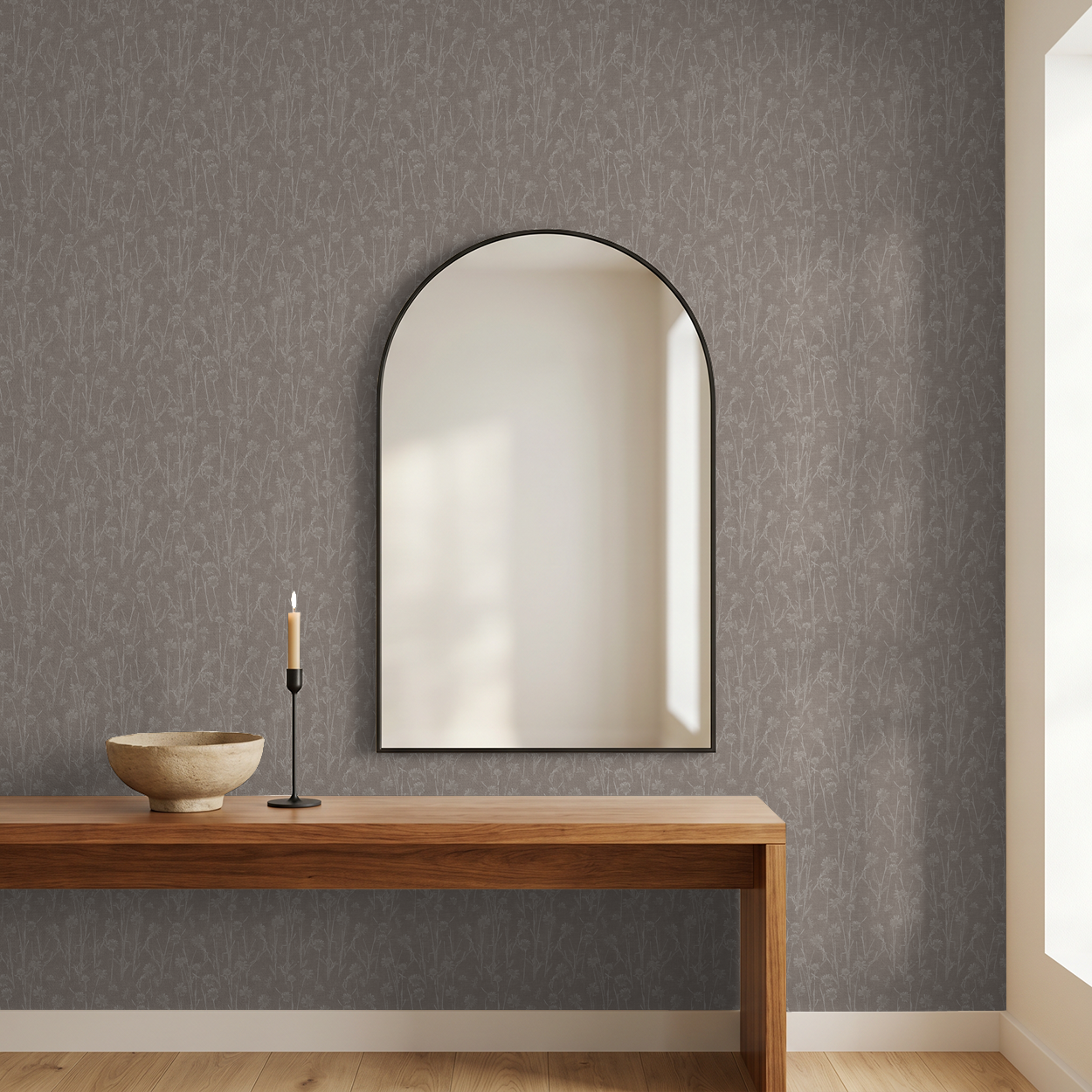 Brown floral wallpaper with delicate wildflower motifs in a modern room with mirror and wooden table.