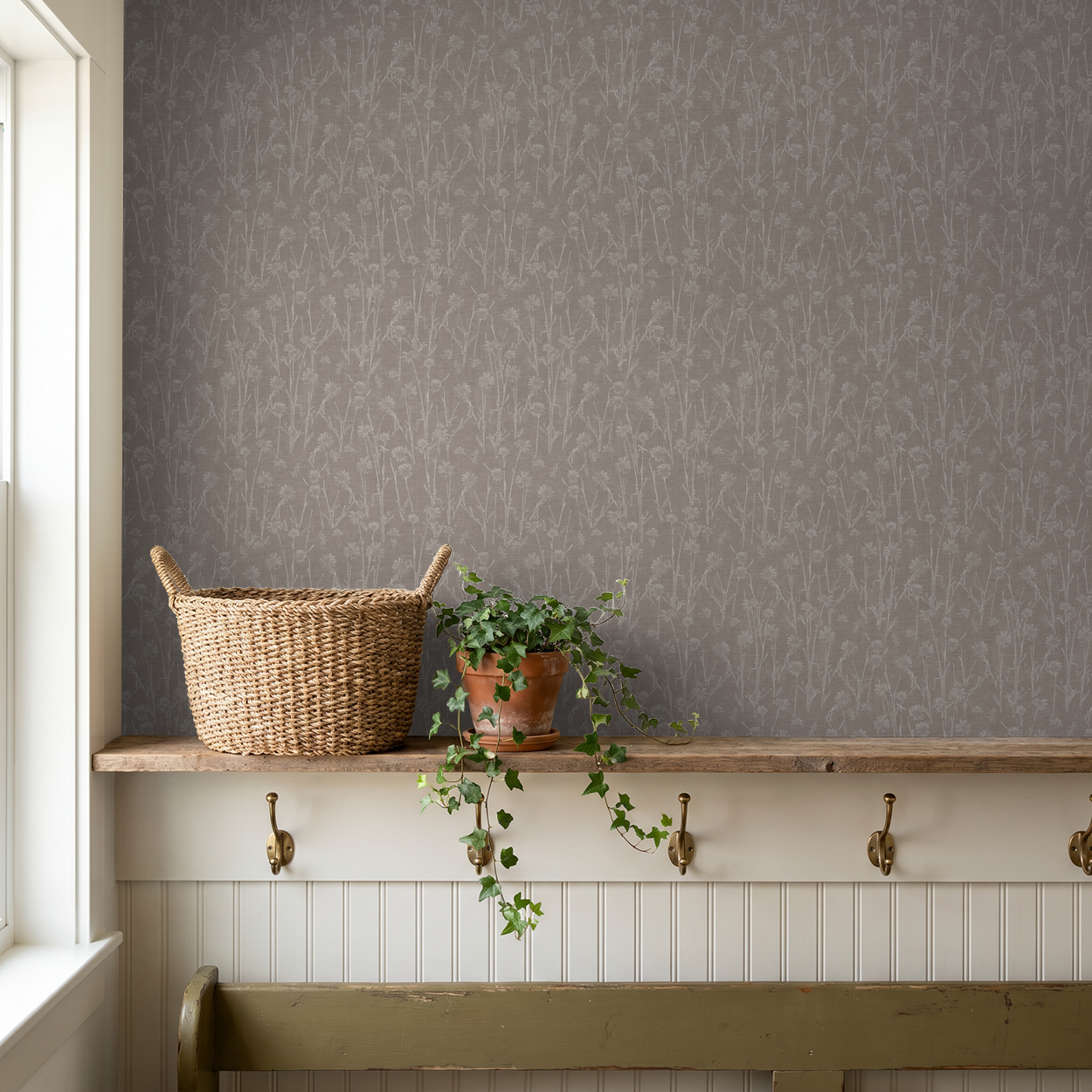 Brown floral wallpaper with delicate wildflower pattern in rustic room setting.