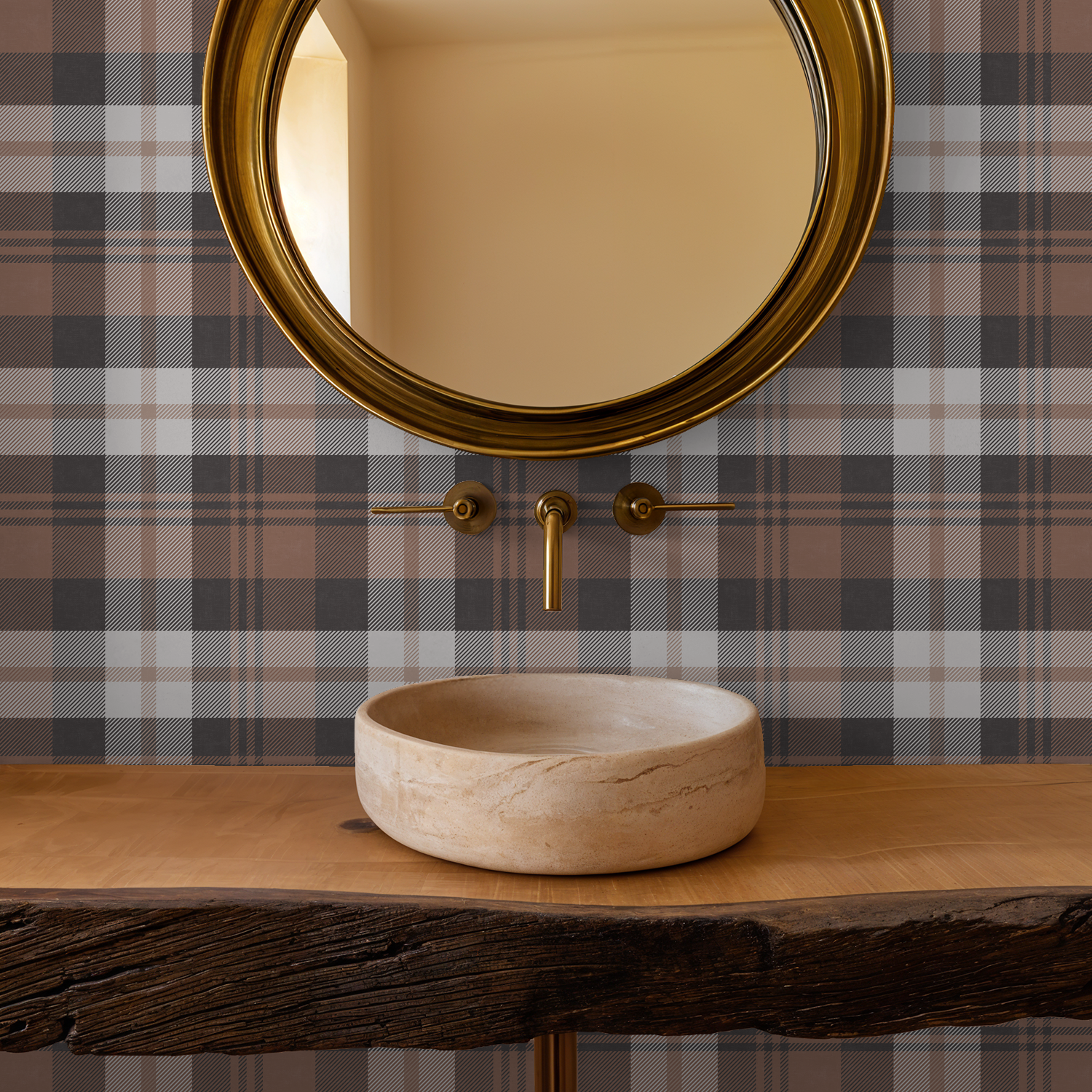 Burnt orange plaid wallpaper in bathroom with round mirror and stone sink.
