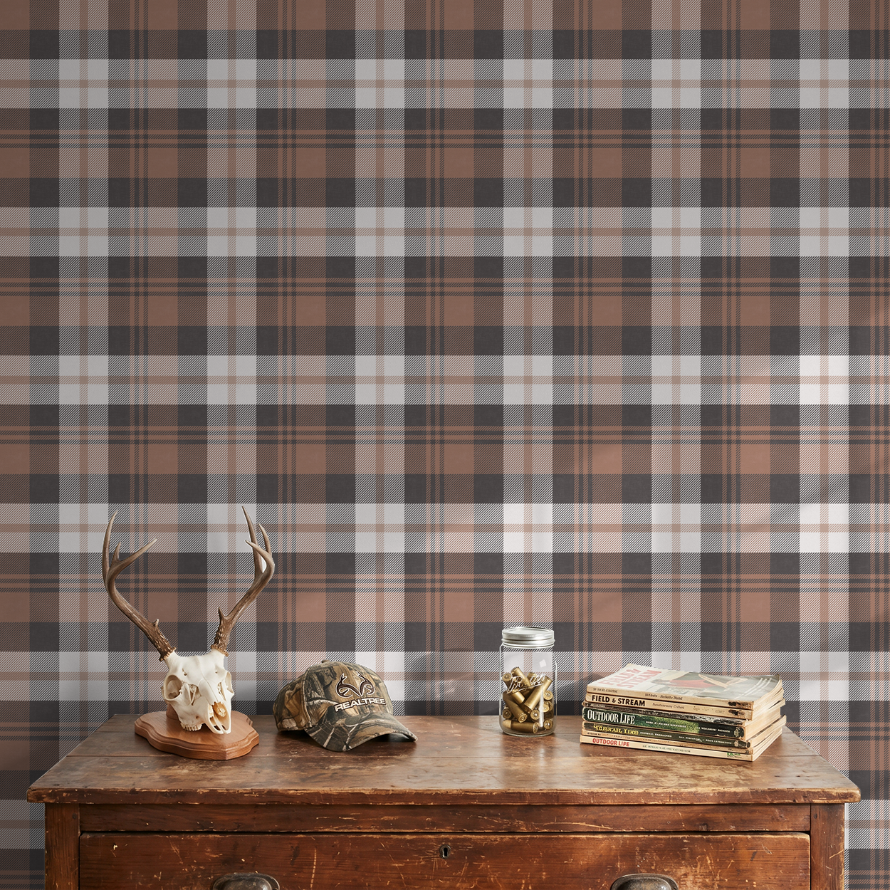 Burnt orange plaid wallpaper in rustic room with wooden table and decor.
