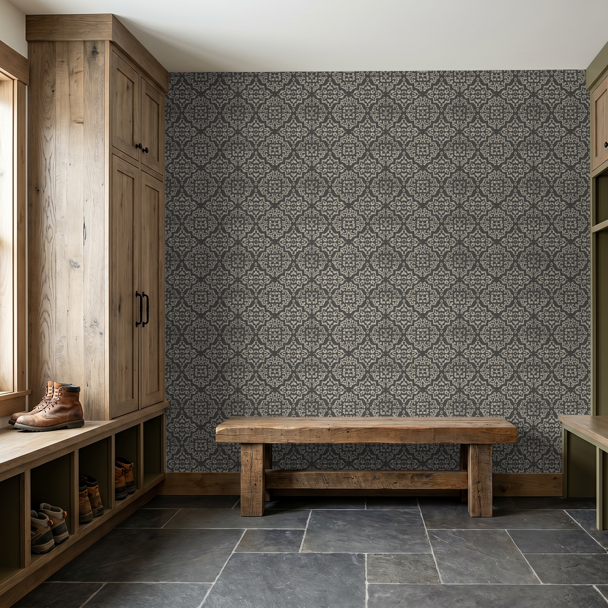 Charcoal damask wallpaper in rustic mudroom with wooden bench and cabinets.