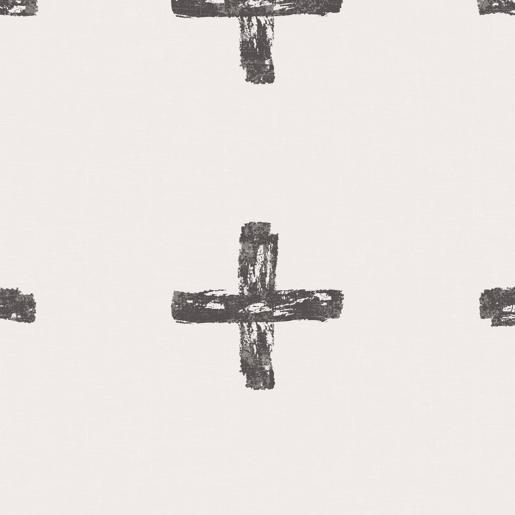Charcoal painterly cross pattern on cream wallpaper, modern and minimalist.