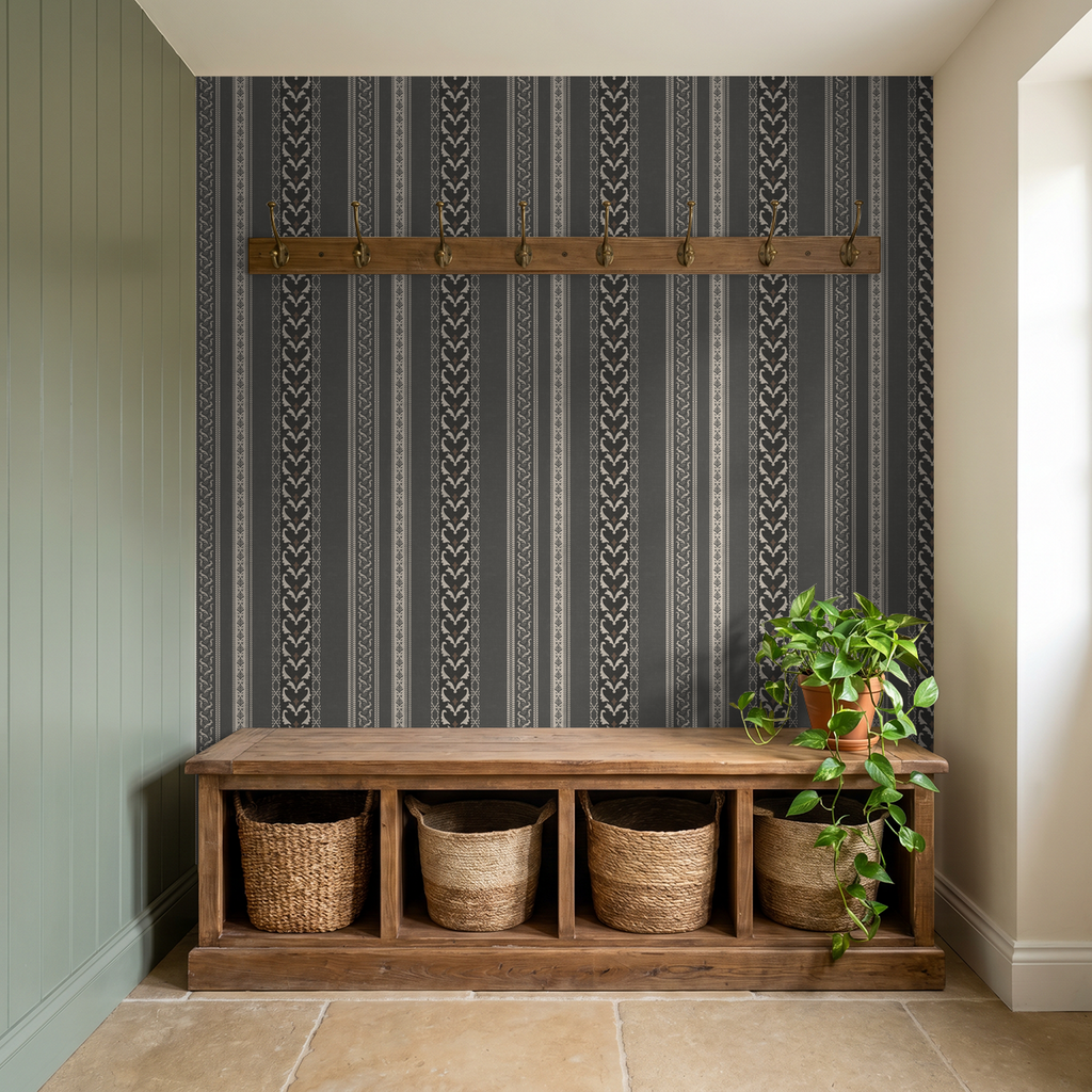 Charcoal vintage ornamental stripe wallpaper in rustic hallway with wooden bench and plant.