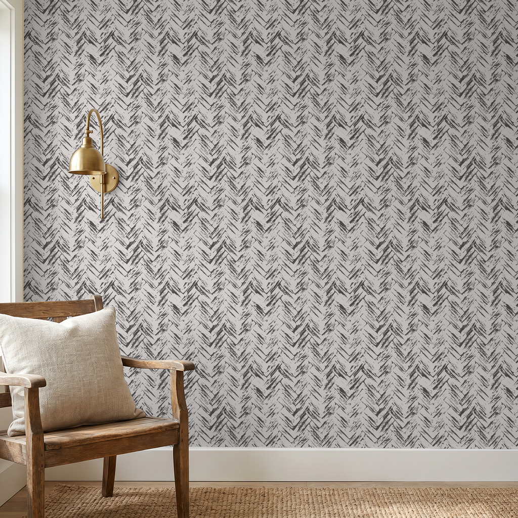 Chevron pattern cream on charcoal wallpaper in rustic room with wooden chair.