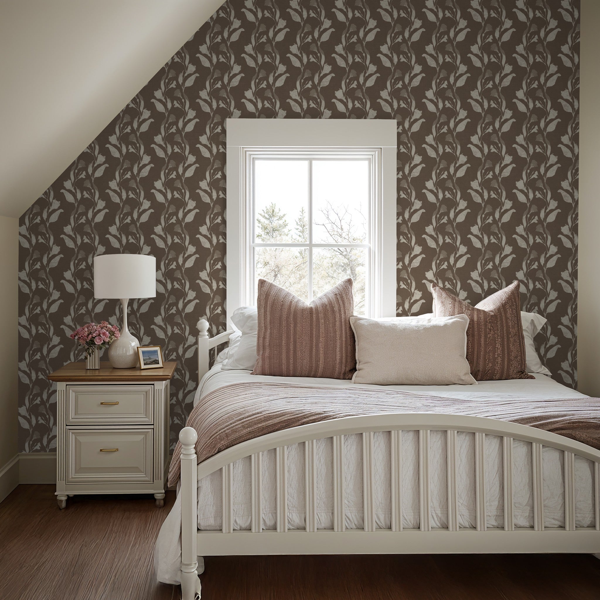 Cream botanical vine wallpaper in cozy bedroom with white bed and taupe accents.
