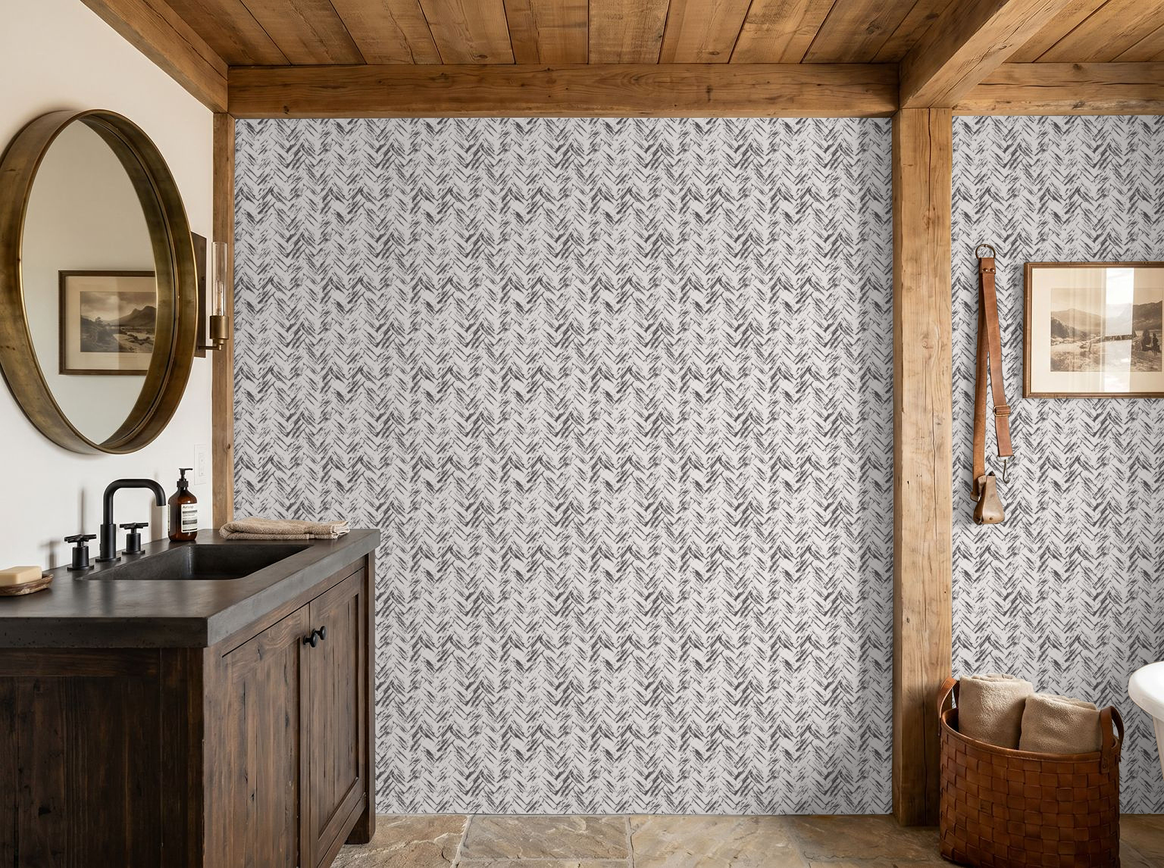 Rustic bathroom with cream and charcoal herringbone wallpaper, wooden vanity and mirror.