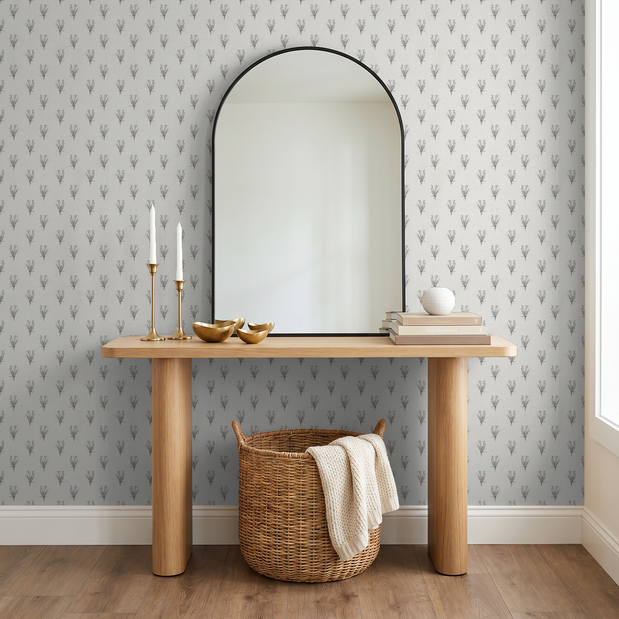 Cream wallpaper with grey floral motifs in modern entryway with mirror and wooden table.