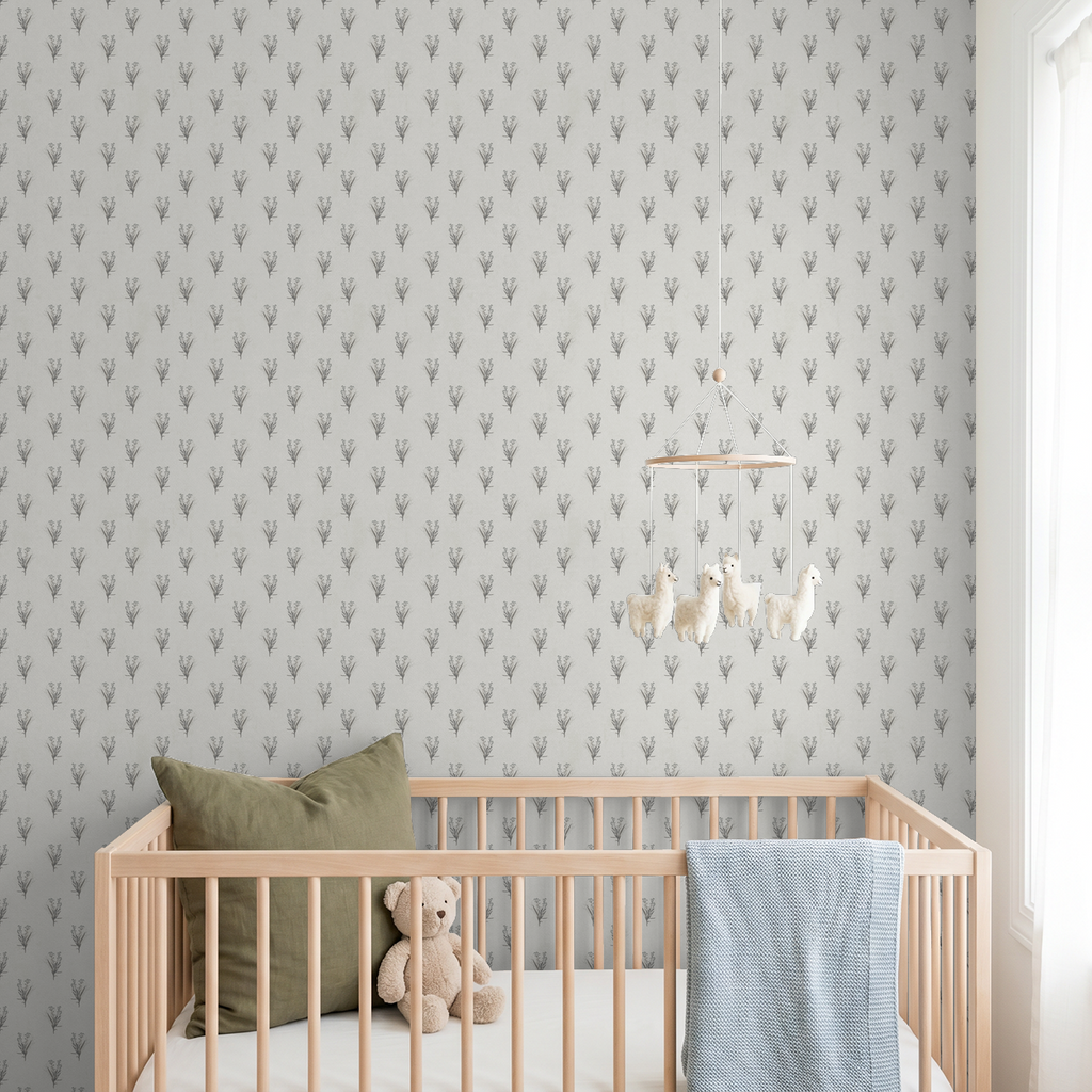 Cream wildflower bouquet wallpaper in a nursery with wooden crib and plush toys.