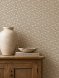 Floral stone wallpaper with delicate white blooms in rustic room setting.