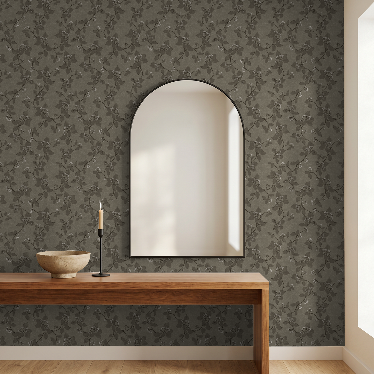 Floral vine moss wallpaper in a room with wooden console and arched mirror.