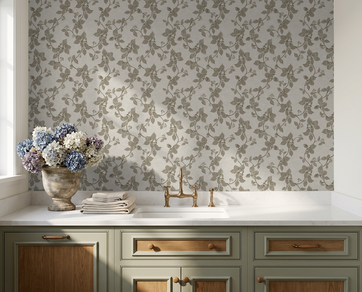Floral vine wallpaper in sepia tones above a kitchen sink with vintage decor.
