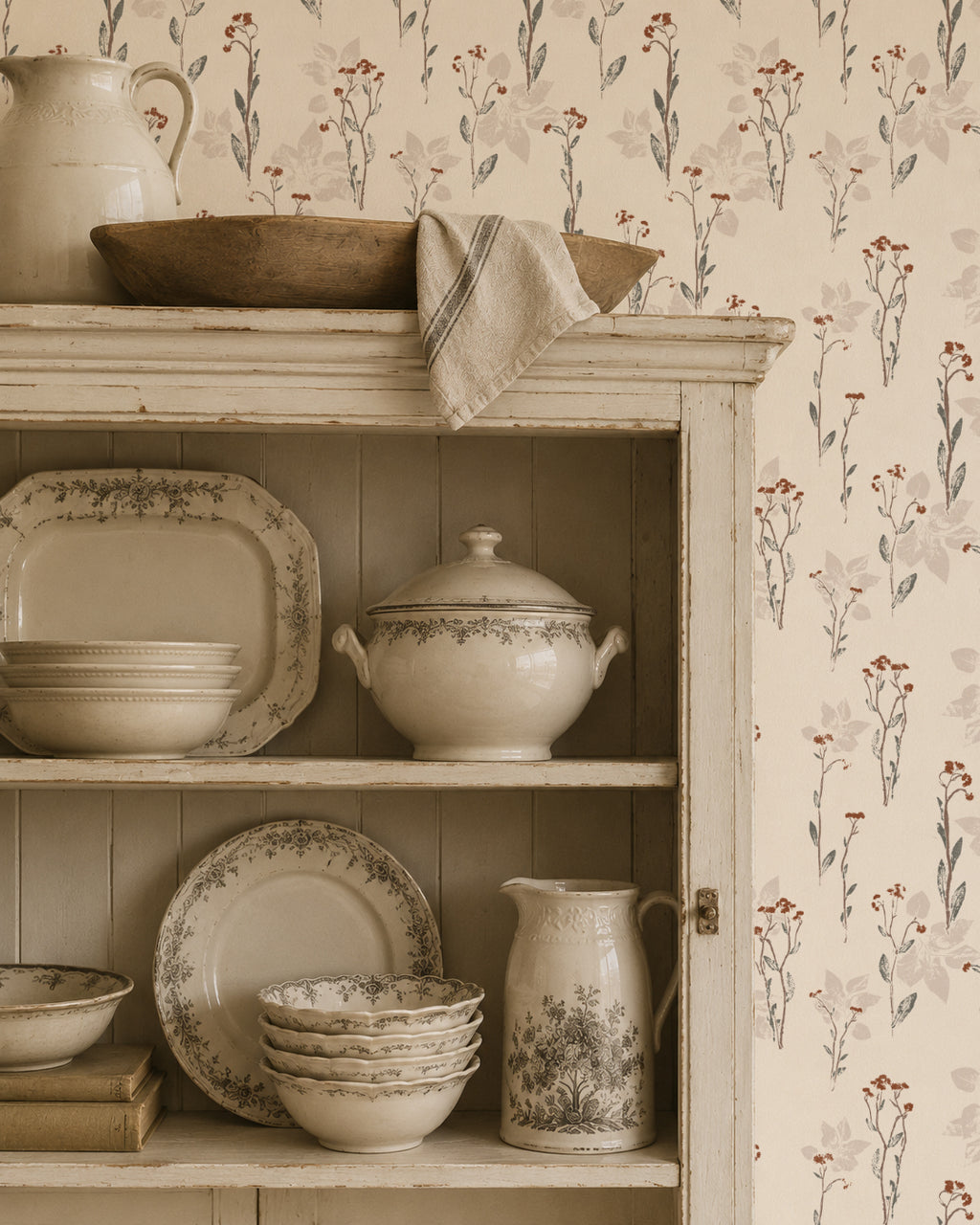 Floral wallpaper with muted earth tones in a vintage kitchen setting.