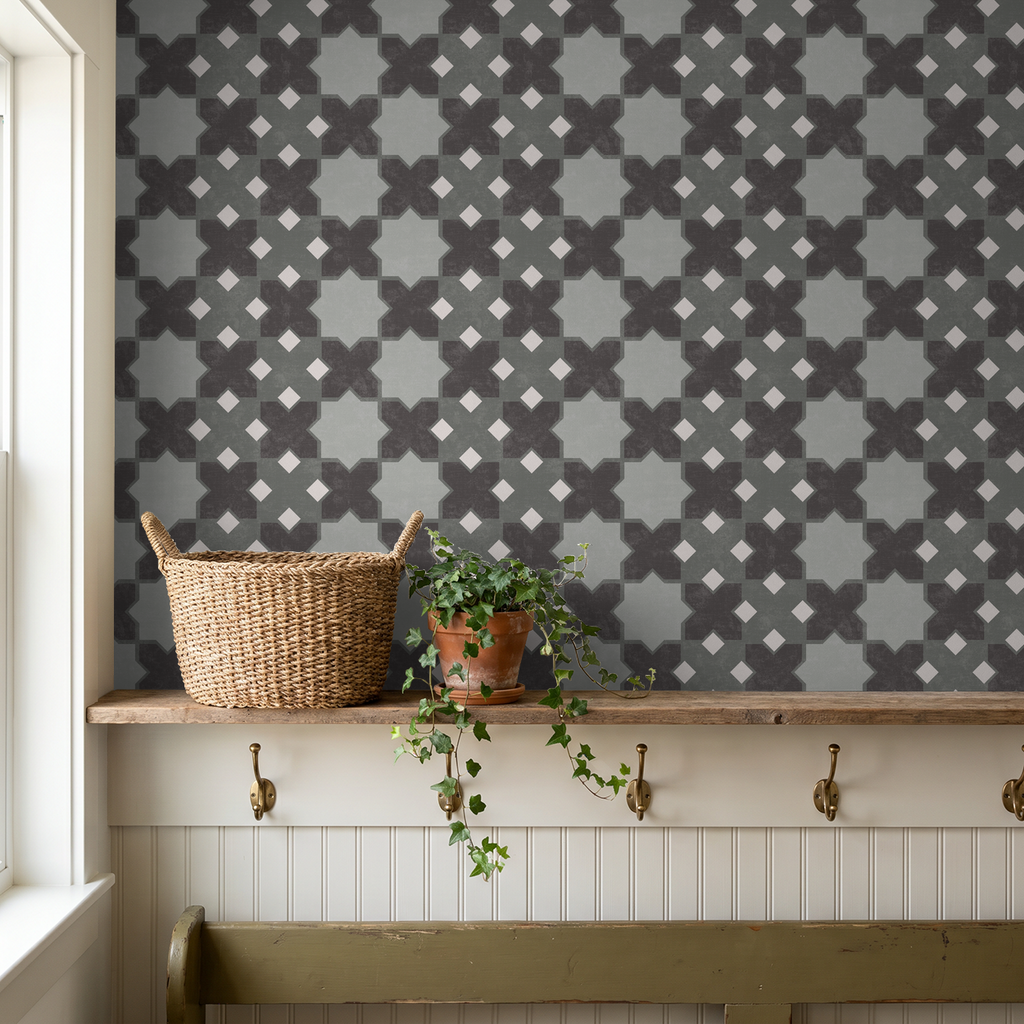 Geometric tile wallpaper in grey tones with basket and plant on shelf.