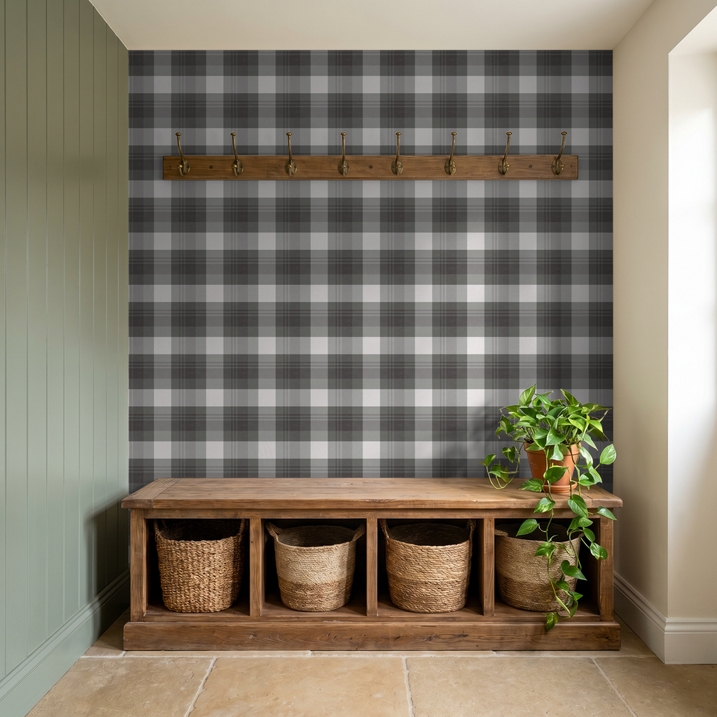 Green and charcoal plaid wallpaper in rustic entryway with wood bench and plant.