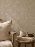 Heritage bloom linen wallpaper with floral pattern in cozy room setting.
