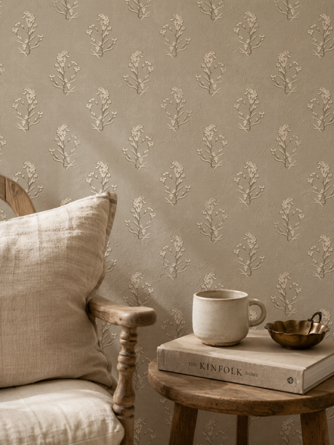 Heritage bloom linen wallpaper with floral pattern in cozy room setting.