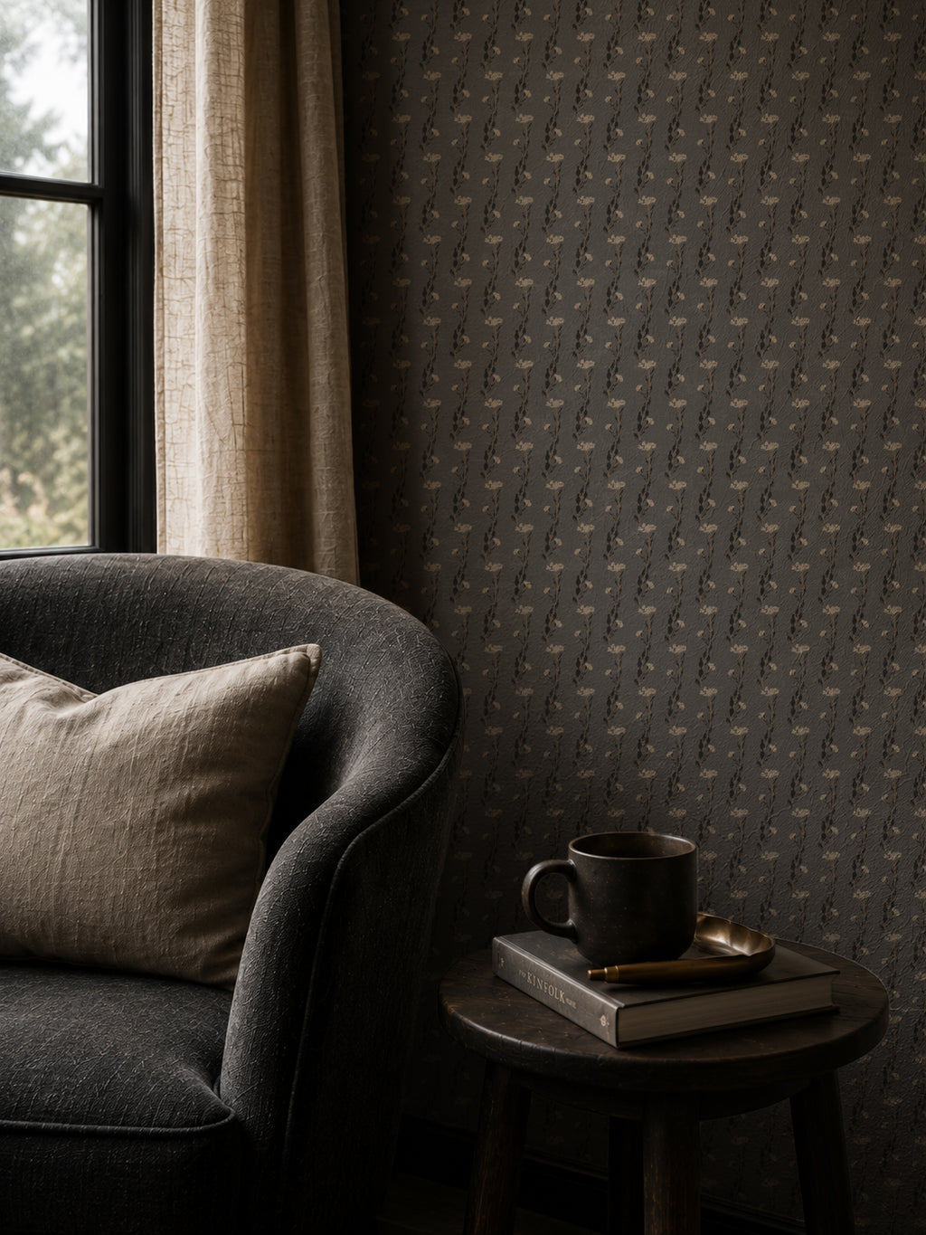 Slate wallpaper with delicate vine pattern in cozy living room with dark armchair.