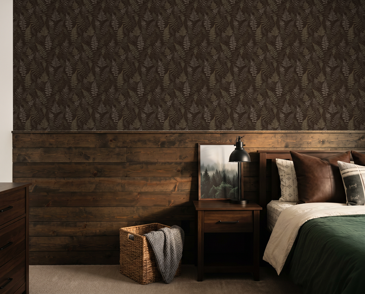 Moody espresso fern wallpaper in rustic bedroom with wood accents.