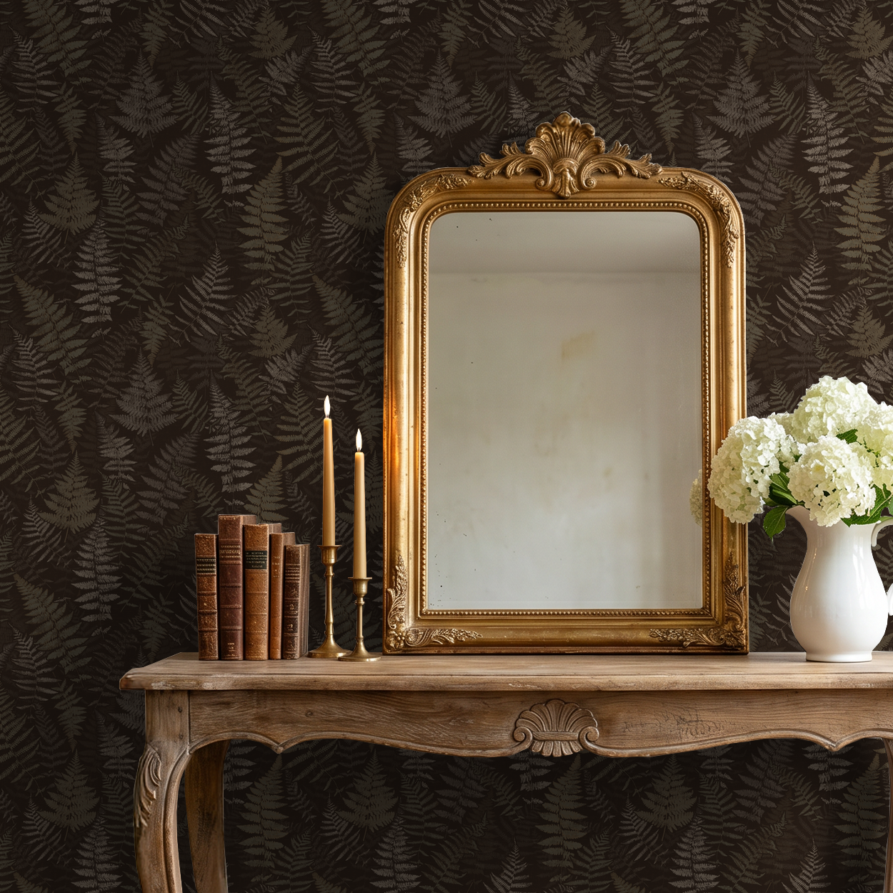 Moody espresso fern wallpaper in rustic room with ornate mirror and flowers.