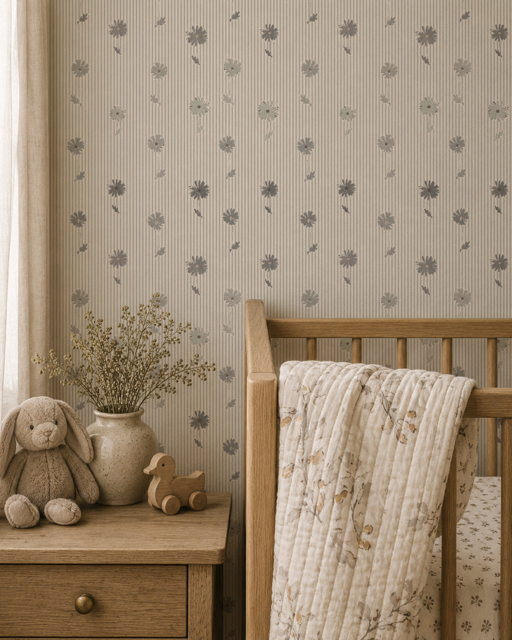 Navy daisy stripe wallpaper in cozy nursery with wooden crib and decor.