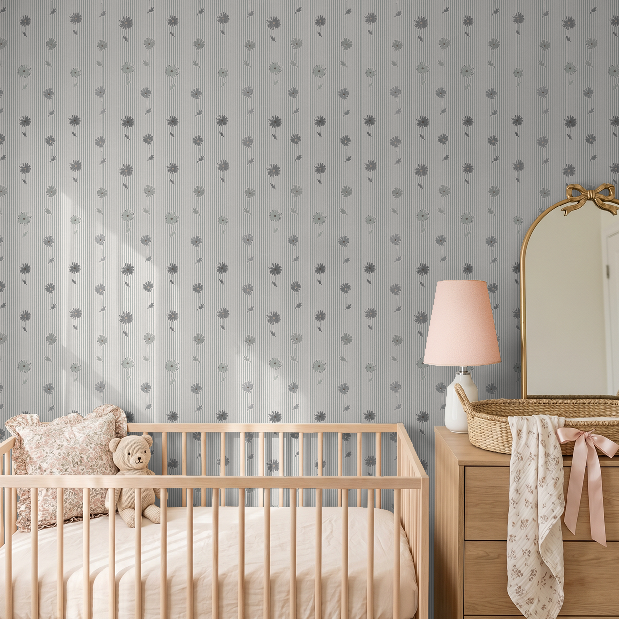 Navy daisy stripe wallpaper in a nursery with crib and dresser.