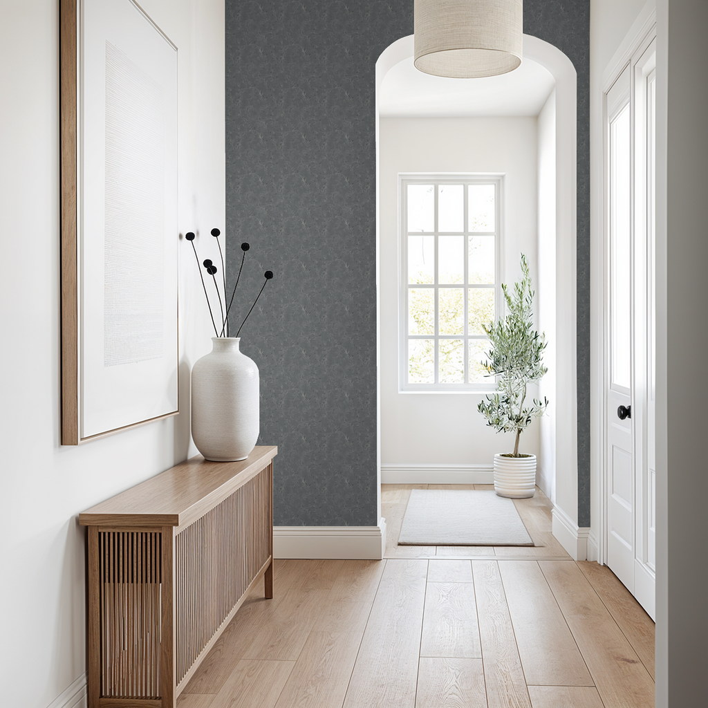 Navy floral vine wallpaper in modern hallway with natural wood decor.