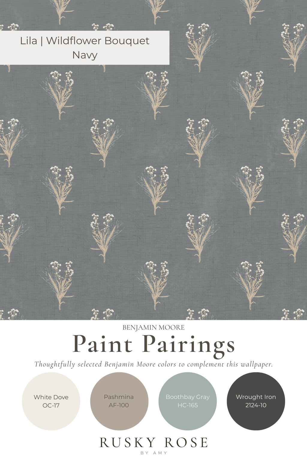 Navy wildflower bouquet wallpaper with cream botanical motifs on a blue-gray backdrop.