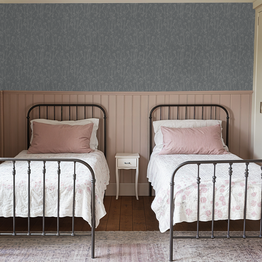 Navy wildflower wallpaper in cozy bedroom with twin beds and pink accents.