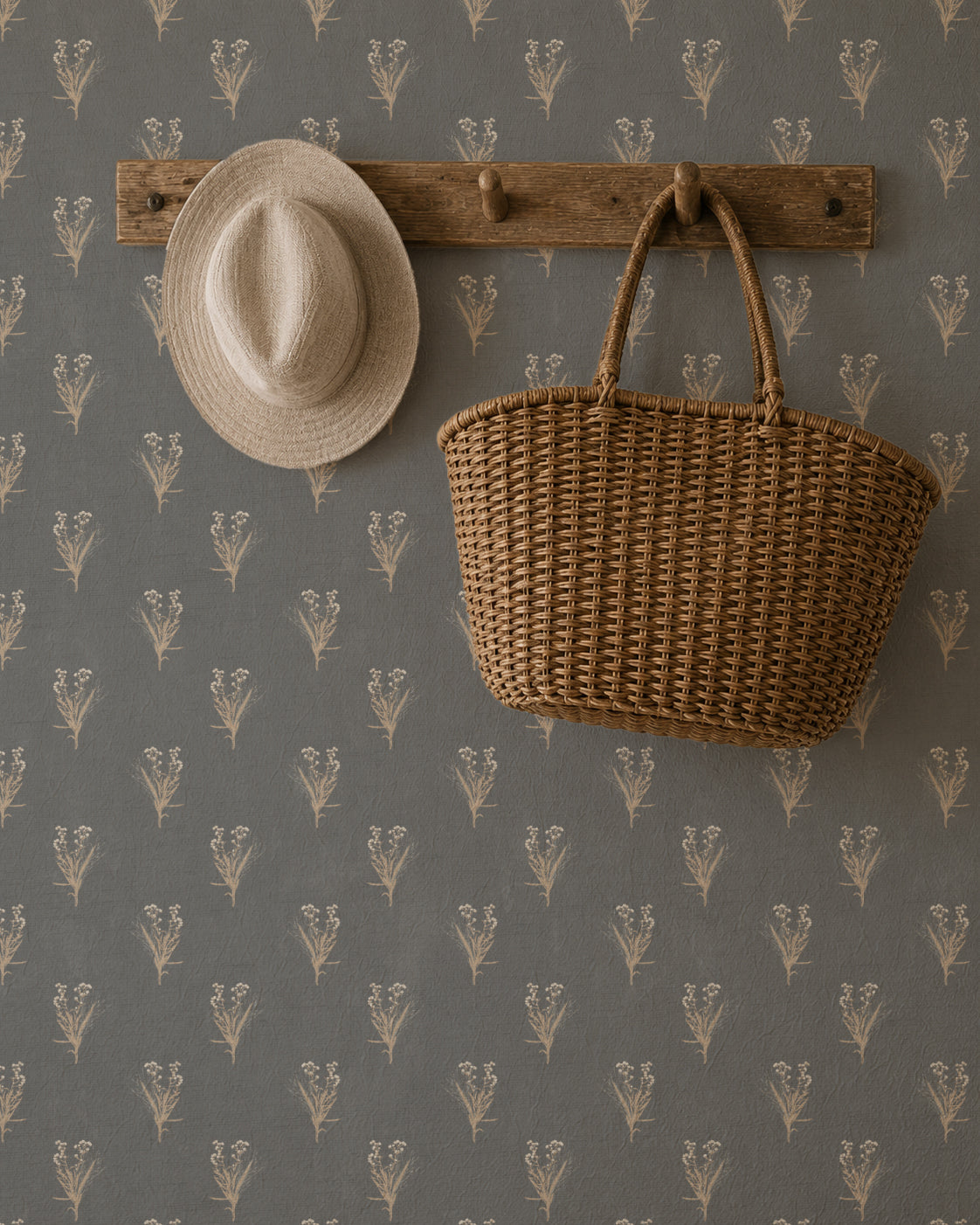 Navy wallpaper with cream wildflower pattern, rustic hat and basket on wooden hook.