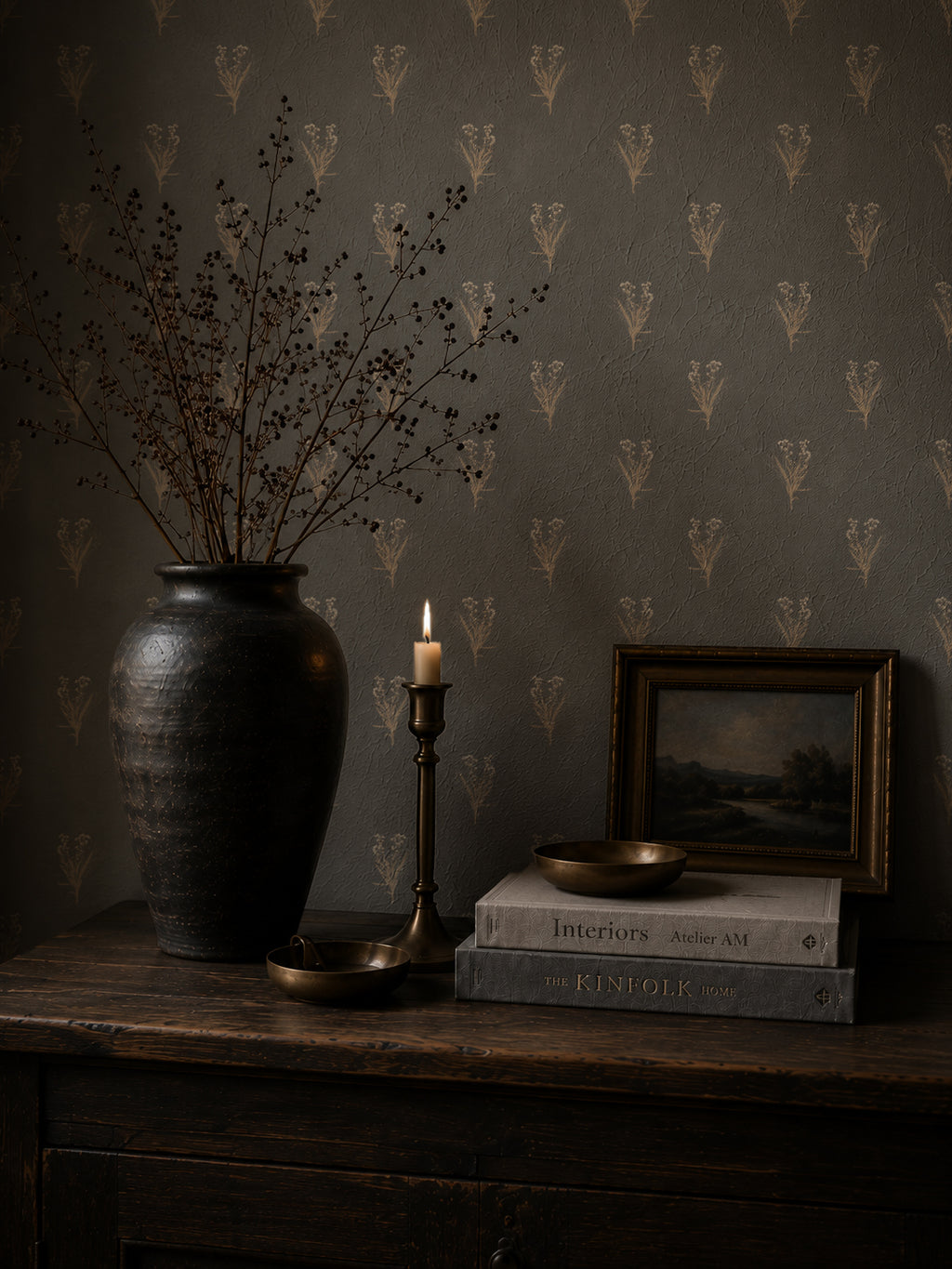Navy wildflower wallpaper with floral motifs in a rustic room setting.
