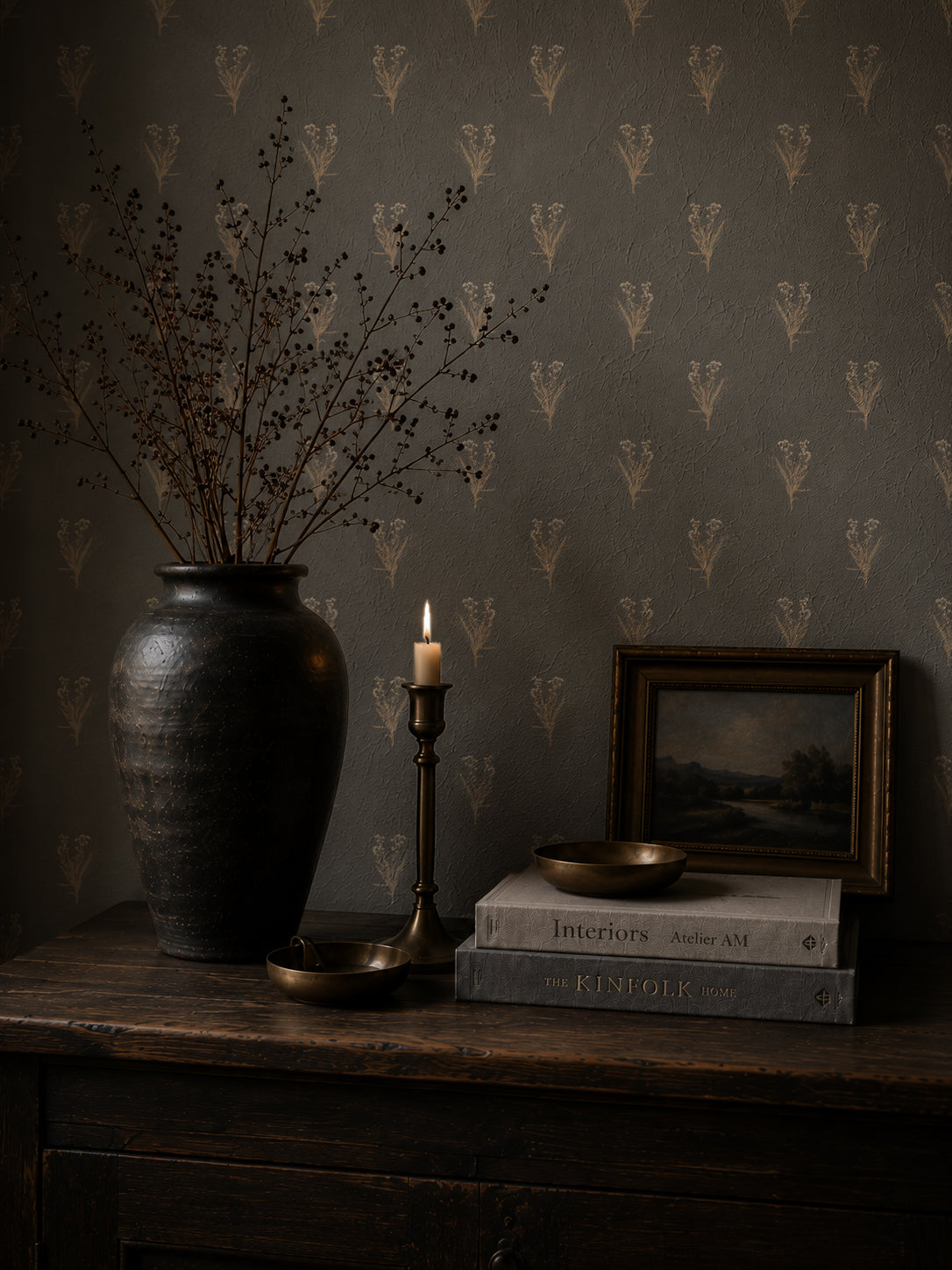 Navy wildflower wallpaper with floral motifs in a rustic room setting.