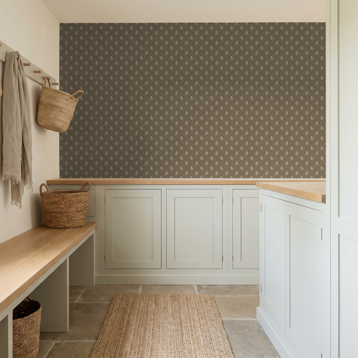 Olive botanical floral wallpaper in rustic mudroom with woven baskets and white cabinetry.