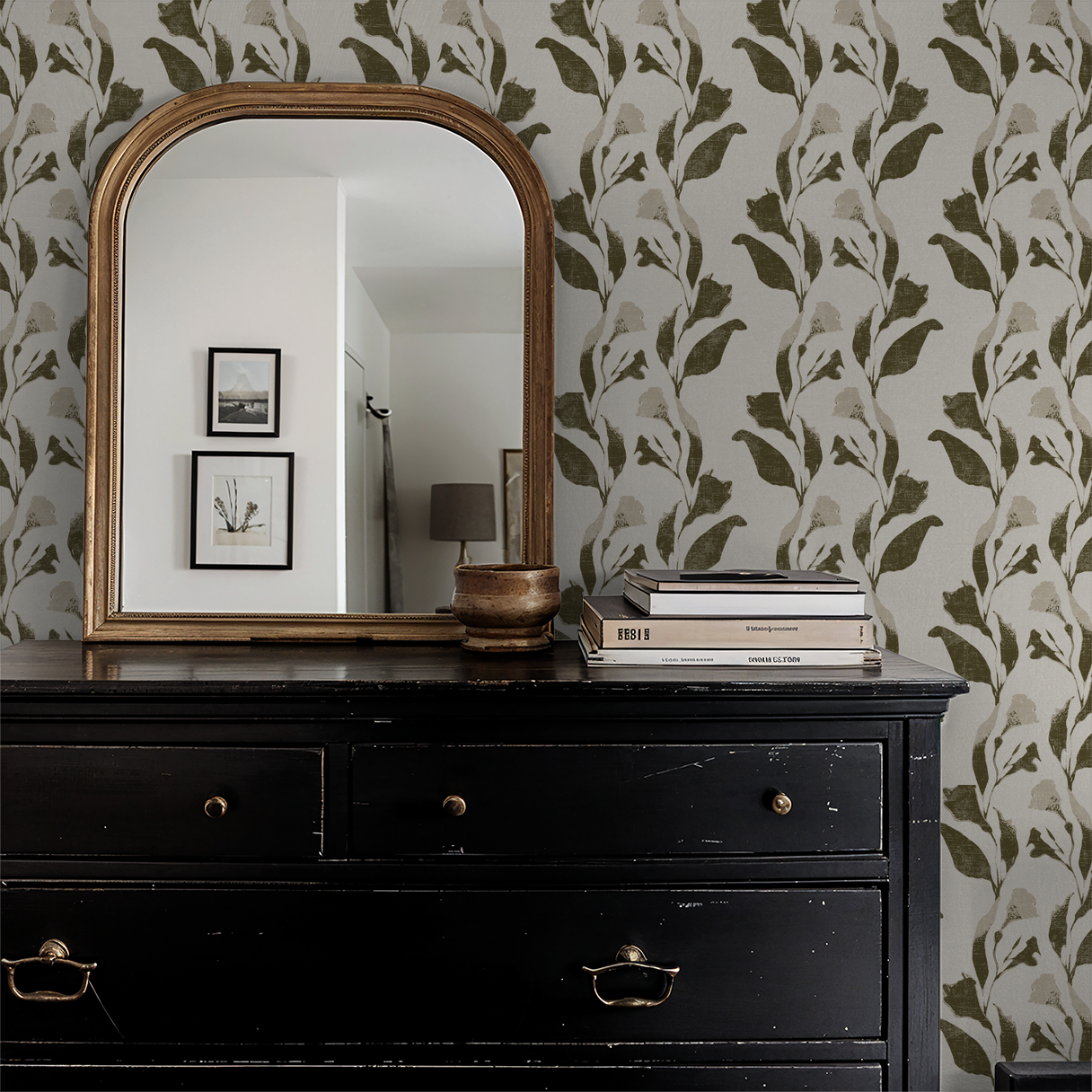 Olive botanical vine wallpaper in room with black dresser and mirror